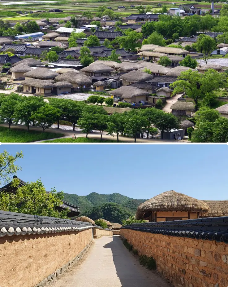Traditional hanok houses in Hahoe Folk Village with mountain backdrop