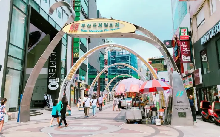 Crowds and steet signs at BIFF Square, Busan.
