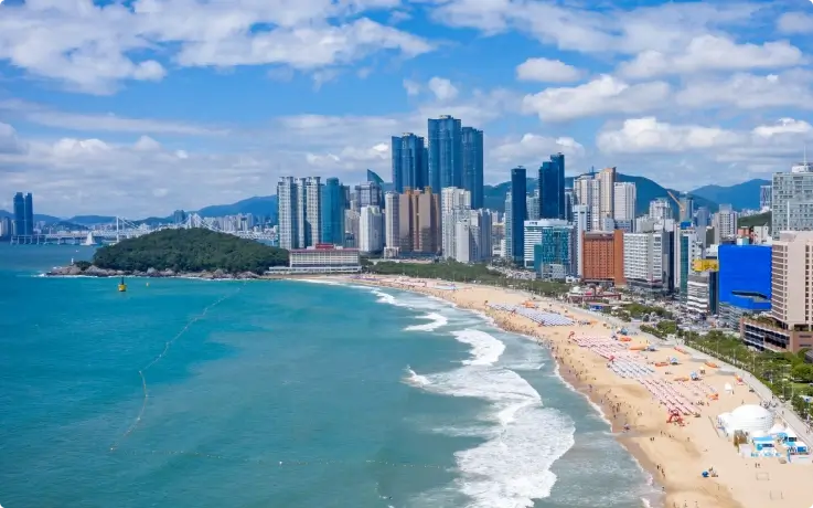 Sandy shoreline and ocean at Haeundae Beach, Busan.