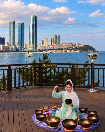 Visitors meditating during a singing bowl in Haeundae, Busan
