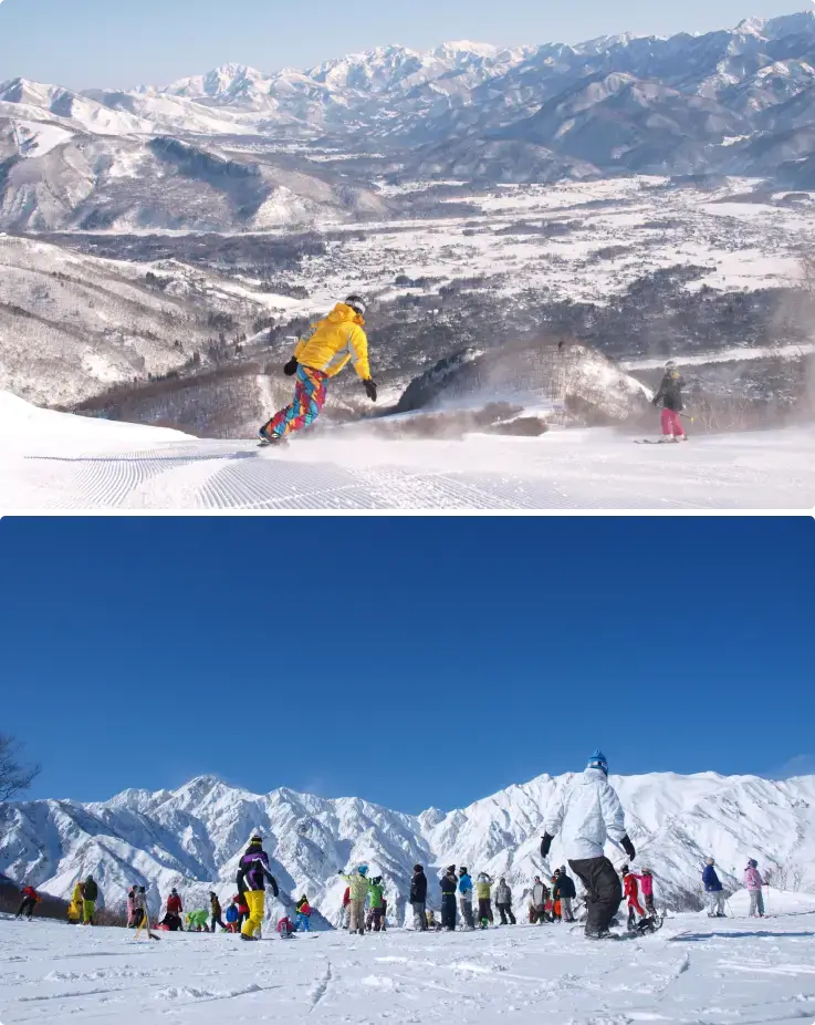 Skiers and snowboarders enjoying smooth slopes with beautiful mountain views at ABLE Hakuba GORYU & Hakuba47 Winter Sports Park.