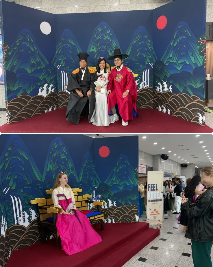 Participants wearing Hanbok taking photos at the photo zone