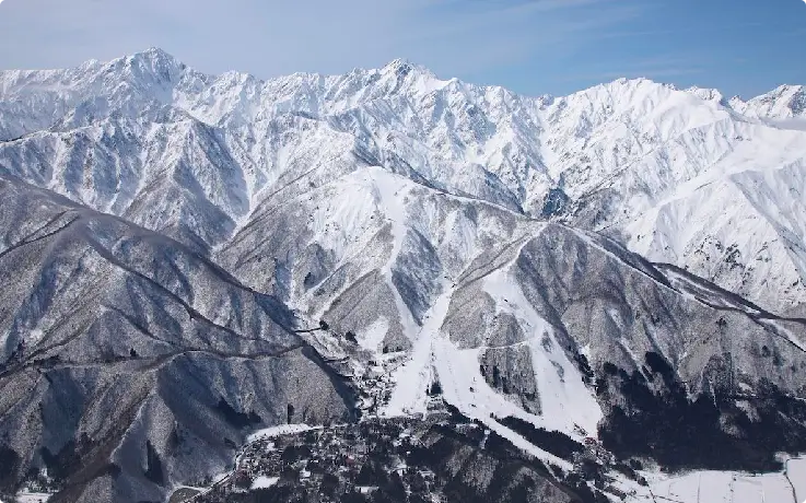 Stunning snowy mountain landscape viewed from the peak of Hakuba GORYU & Hakuba 47.