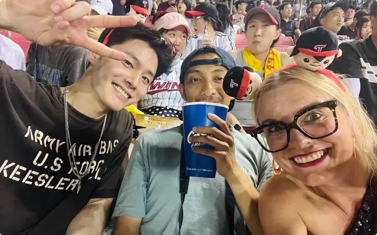 Visitors enjoying baseball game at Seoul Sports Complex.