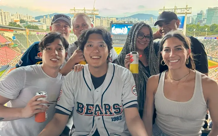 Visitors enjoying baseball game at Seoul Sports Complex.