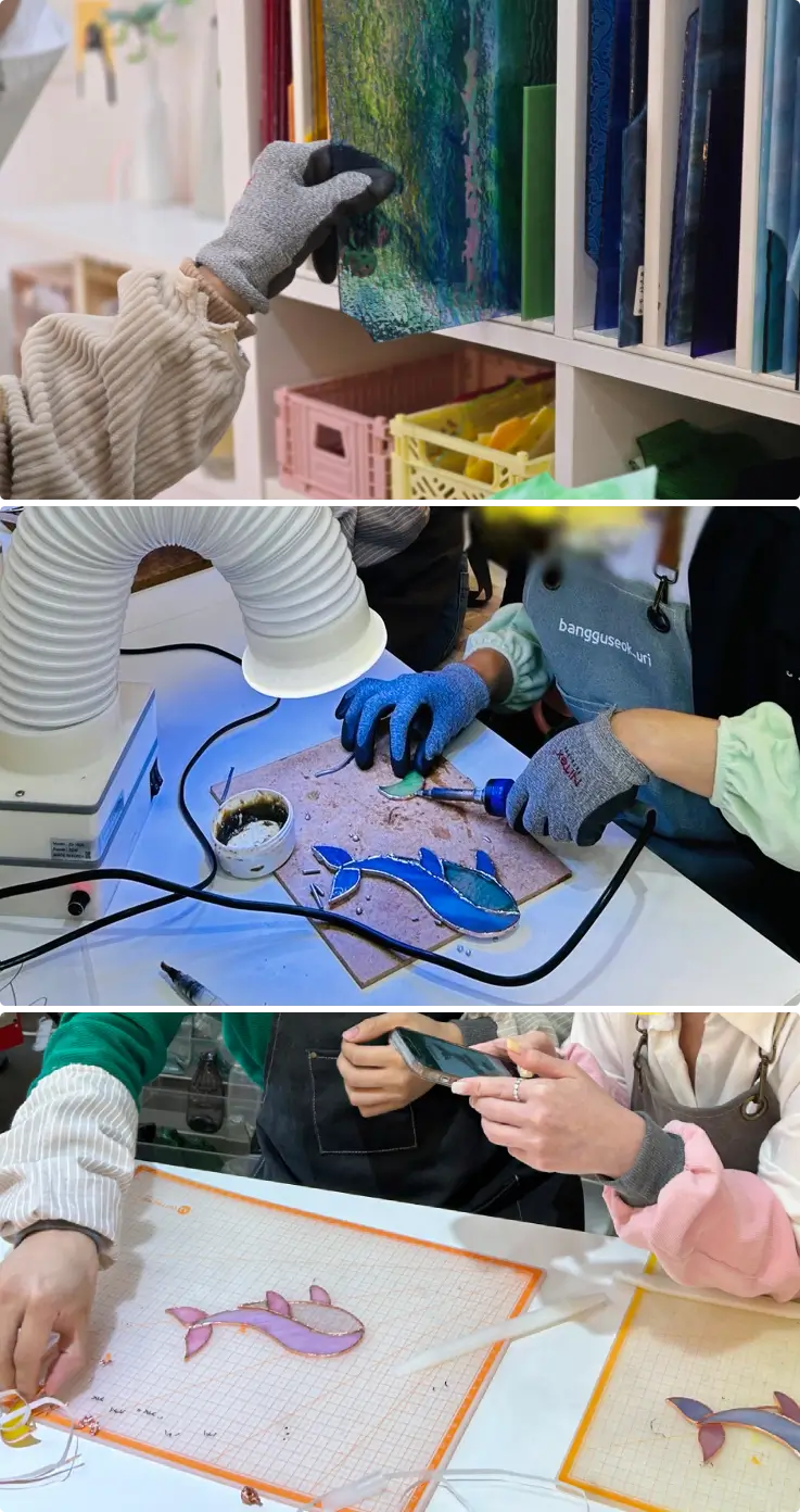 Instructor guiding participants during stained glass workshop in Busan