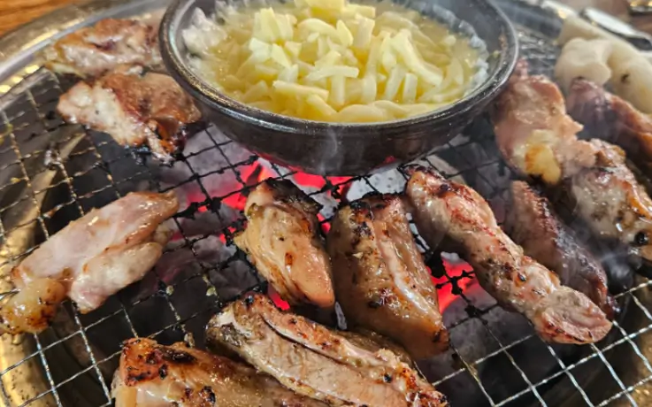 Chuncheon dakgalbi (stir-fried chicken) with cheese dipping.