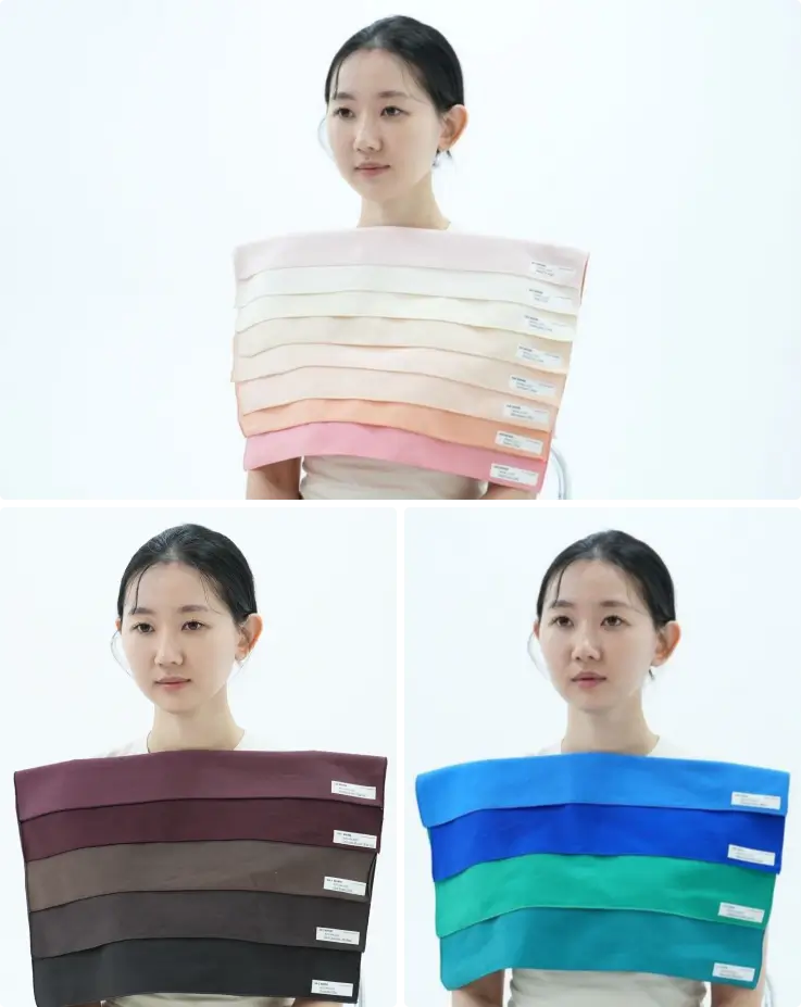Client receiving personal color analaysis in Hongdae using color drapes.