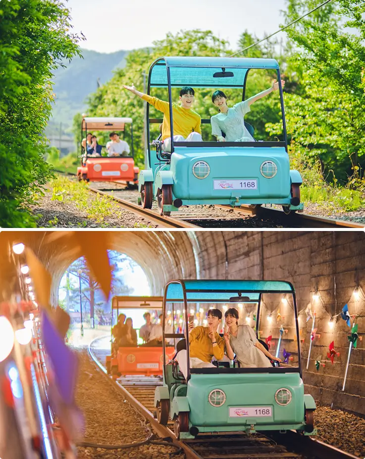 Tourists pedaling along the scenic rail track at Gangchon Rail Park.