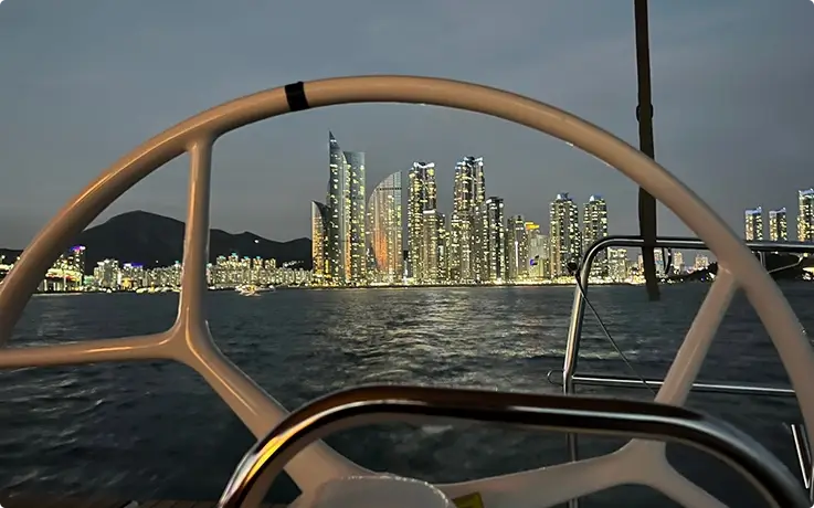 Night view of Marie City from the private yacht in Busan