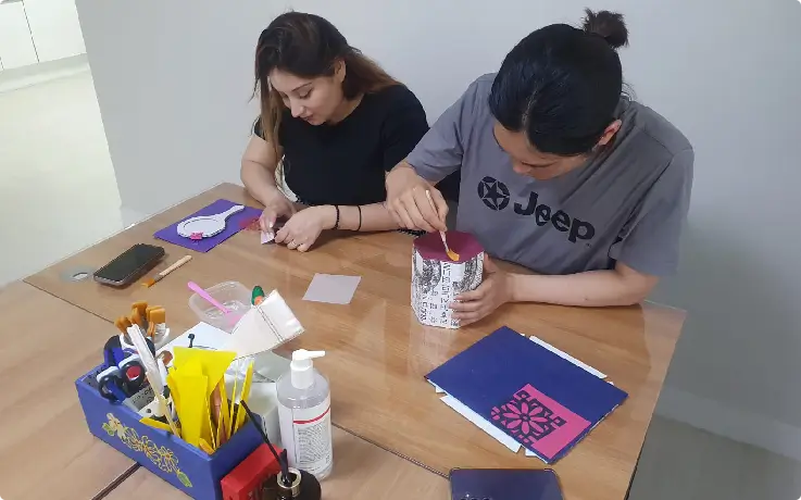 Beginners happily making crafts in a Hanji & Mother-of-Pearl workshop.