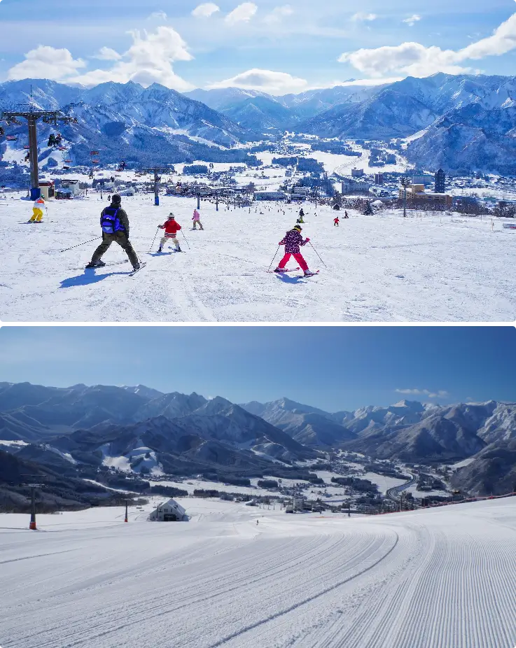 Skiers and snowboarders gliding down the slopes on fresh snow with mountain views at Iwappara Ski Resort.