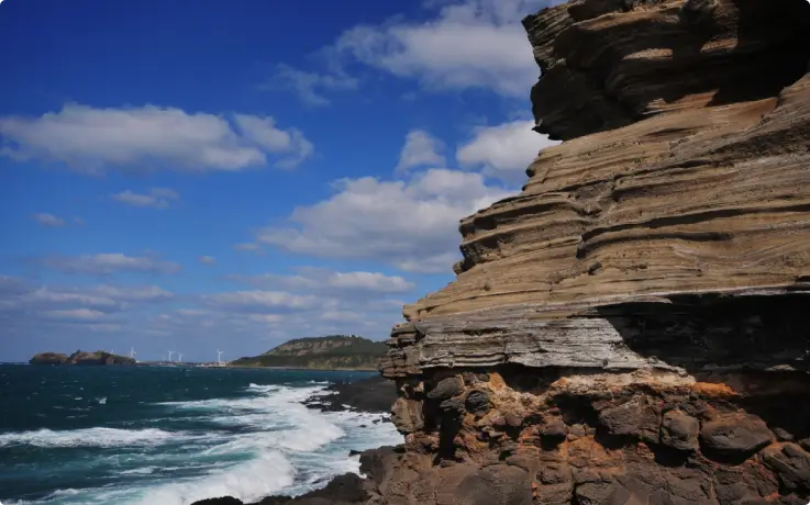 Waves crashing on the rock formations of Suwolbong Peak.