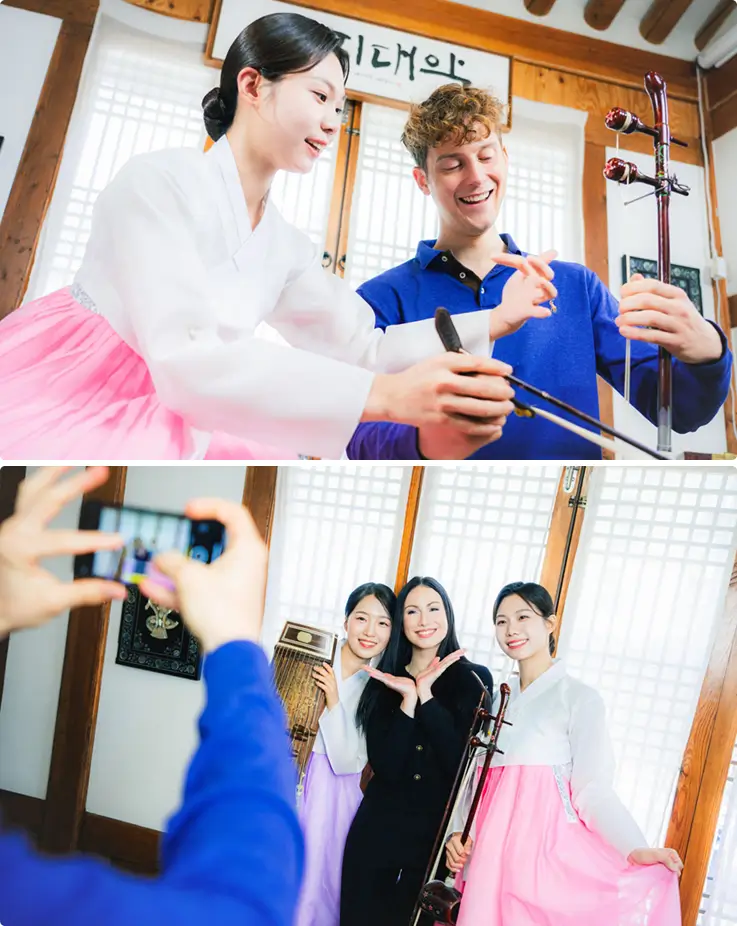 Performers in hanbok teaches a foreign visitor how to play the haegeum, followed by a group photo session.