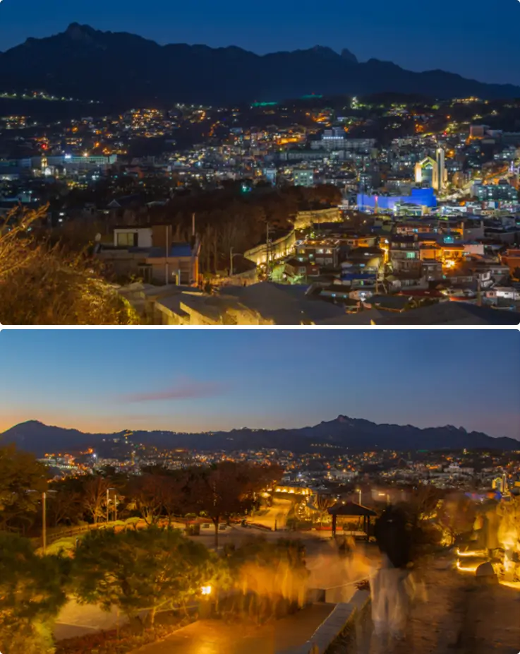 Evening view of Seoul City from Naksan Park's fortress walls.