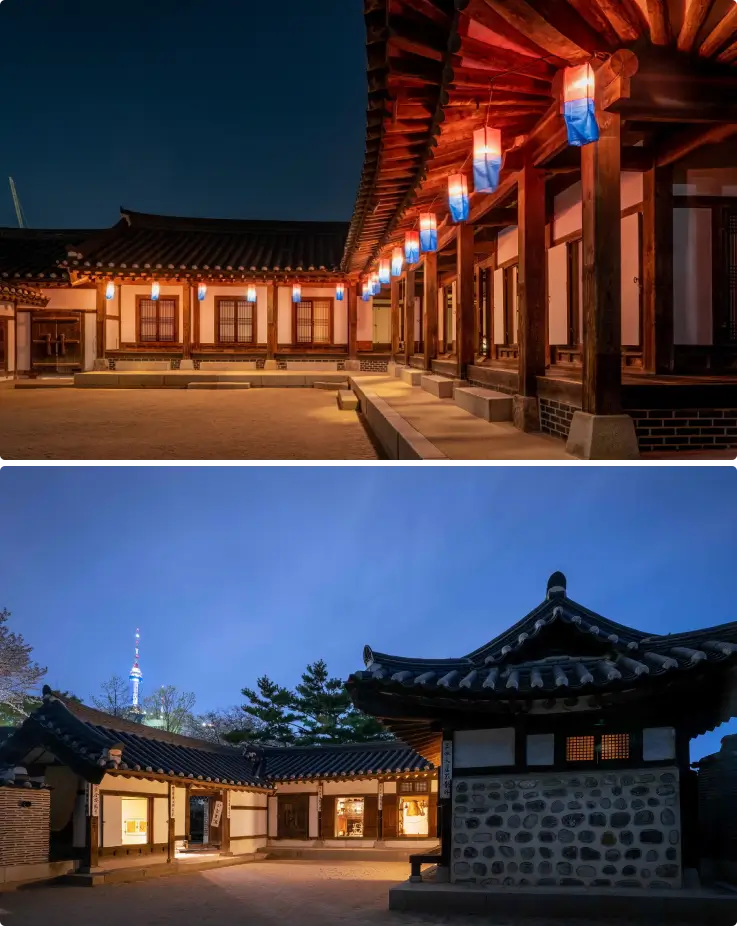 Hanok houses at Namsangol Hanok Village lit up in the night.