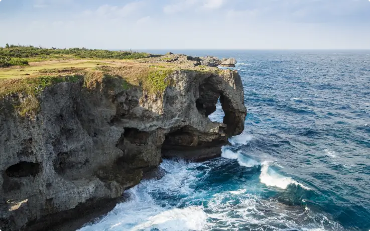 Elephant-shaped rock formation at Cape Manzamo overlooking the ocean.