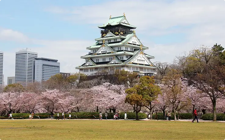Osaka Castle surrounded by park grounds in central Osaka.