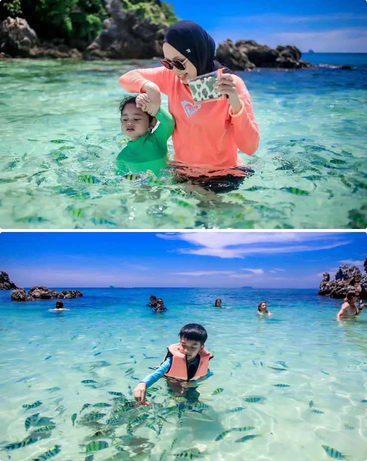 Visitors at the Khai Islands observing fish
