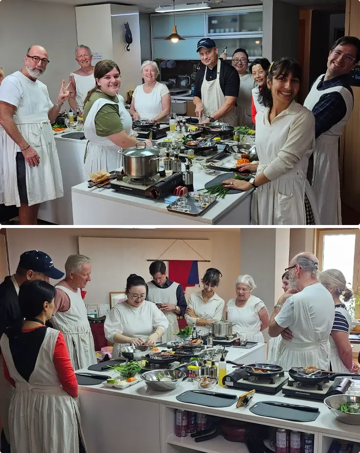 Visitors preparing traditional Korean dishes during a cooking class in Busan