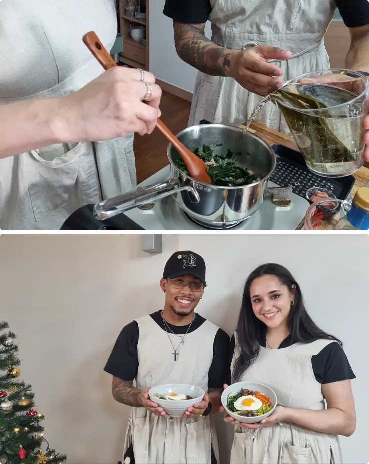 Visitors preparing traditional Korean dishes during a cooking class in Busan