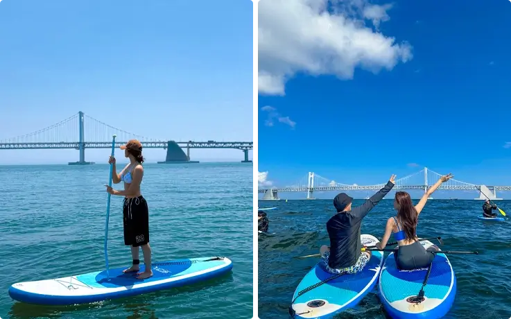 Visitors enjoying paddleboarding at Gwangalli Beach