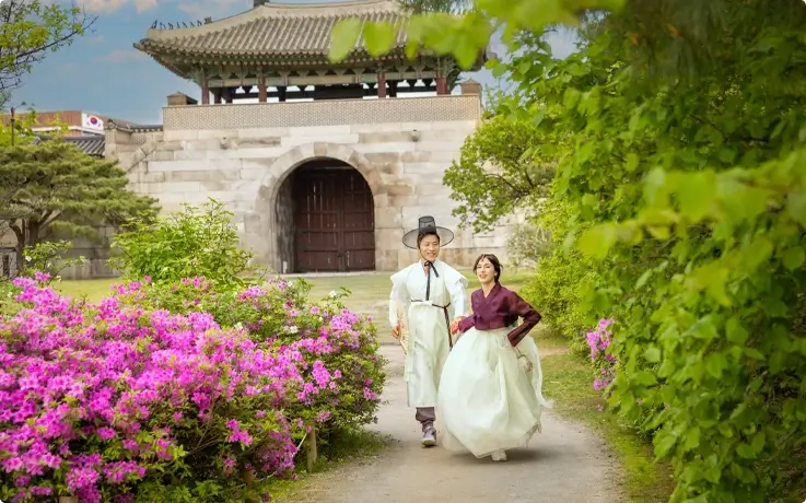 A couple wearing Hanbok from Daehan Hanbok at Gyeongbokgung Palace