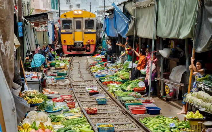 Train crossing the Maeklong Railway Market