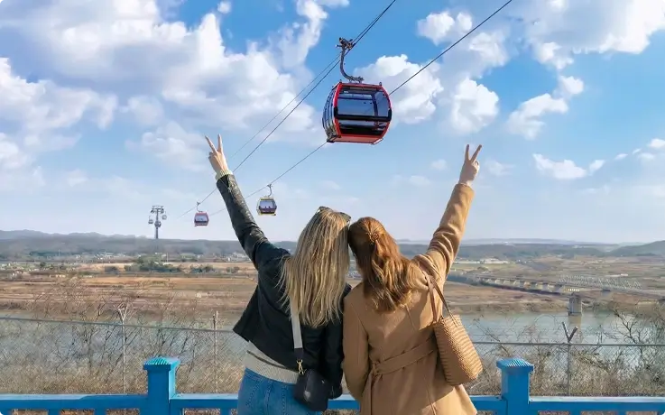 Visitors taking photos with the DMZ gondola