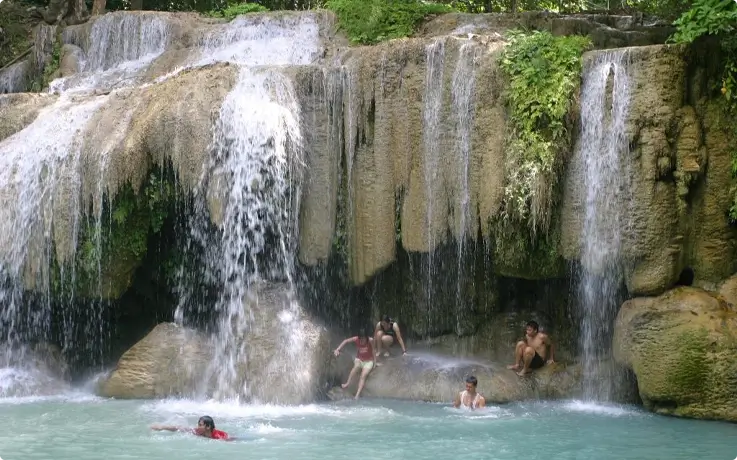 Visitors swimming at Erawan Waterfall in Kanchanaburi