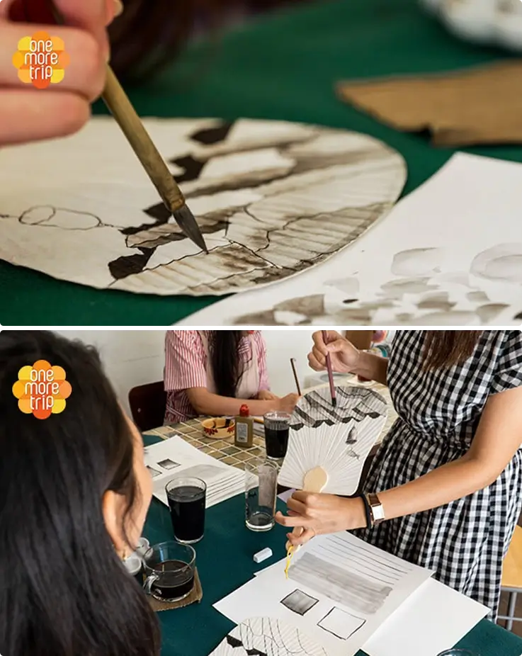 Visitor painting Hanok illustration on a fan