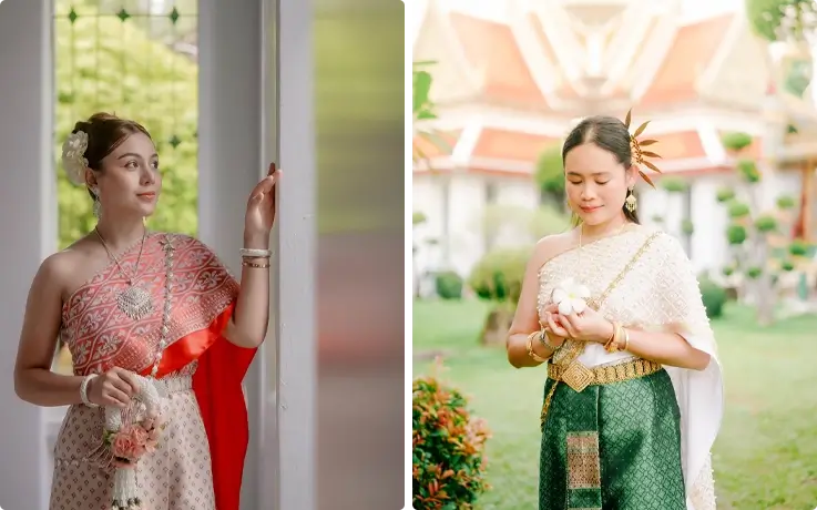 Visitors taking photos in Thai costumes near Wat Arun