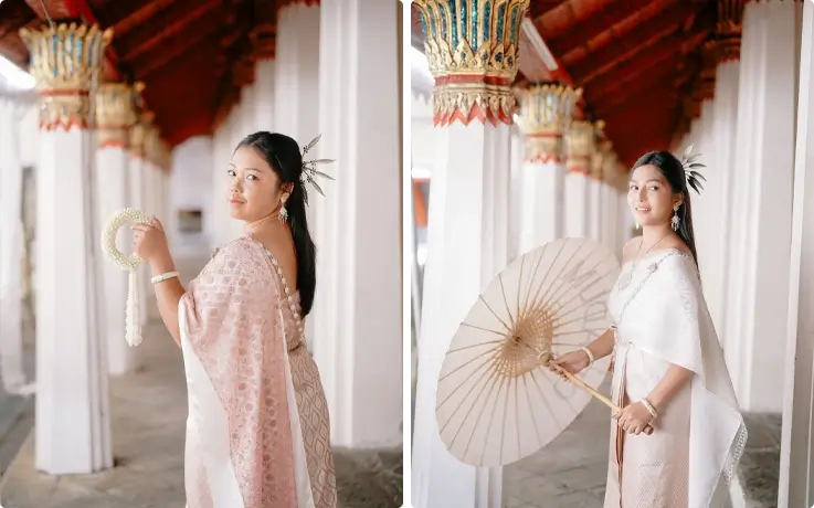 Visitors taking photos in Thai costumes near Wat Arun