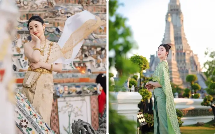 Visitors taking photos in Thai costumes near Wat Arun