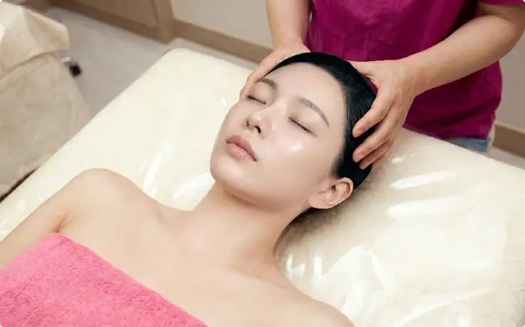Visitor receiving basic course at Hana Mud Spa in Myeongdong