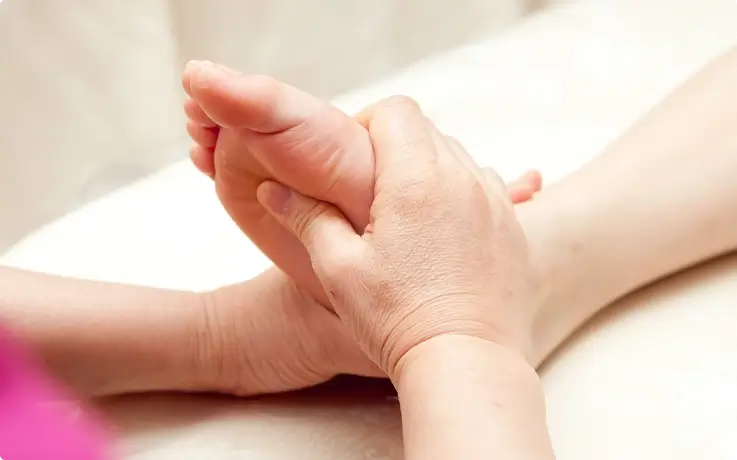 Visitor receiving foot massage at Hana Mud Spa in Myeongdong