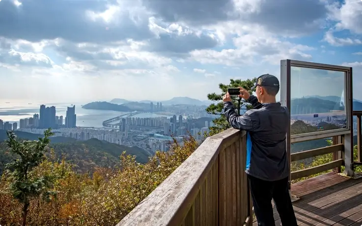 Visitor taking photos at Jangsan Mountain in Busan