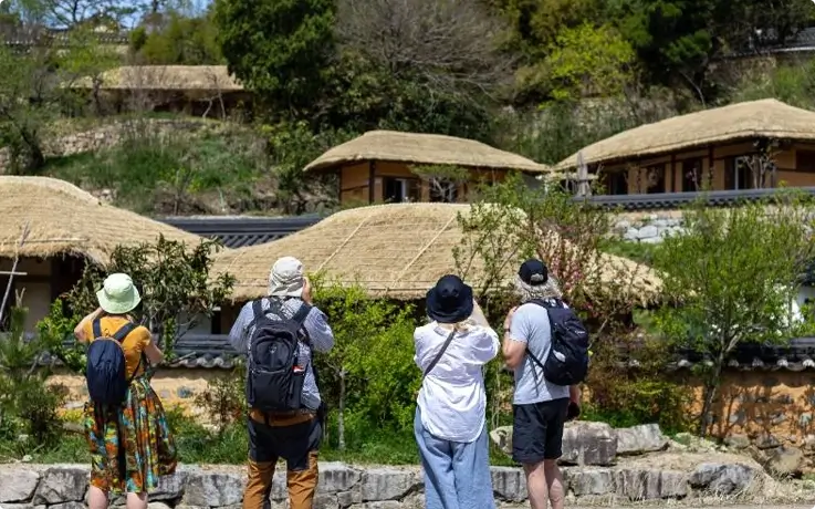 Visitors taking photos at Yangdong Traditional Village in Gyeongju