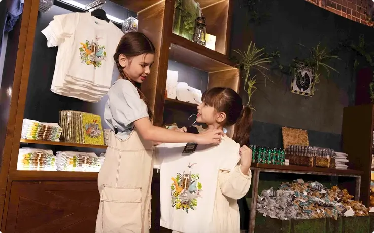 Visitors browsing the souvenir shop at Jurassic World: The Experience in Bangkok