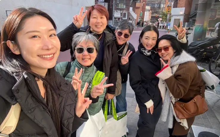Visitors taking photos at the K-Beauty shopping tour in Myeongdong