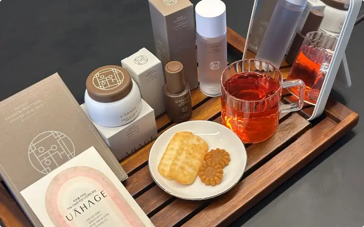 UAHAGE skin products with welcome tea and snacks for a Korean skincare class in Seongsu