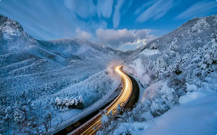 Seoraksan Mountain covered in snow in winter with a lit pathway in the center