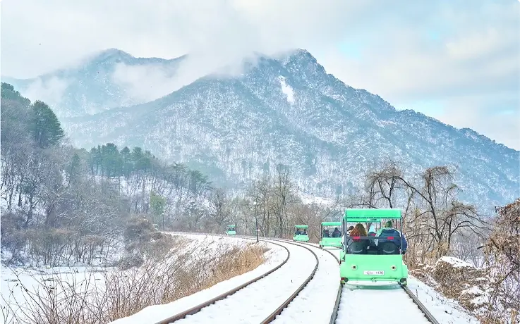 Ganchon rail bike with snow covered tracks
