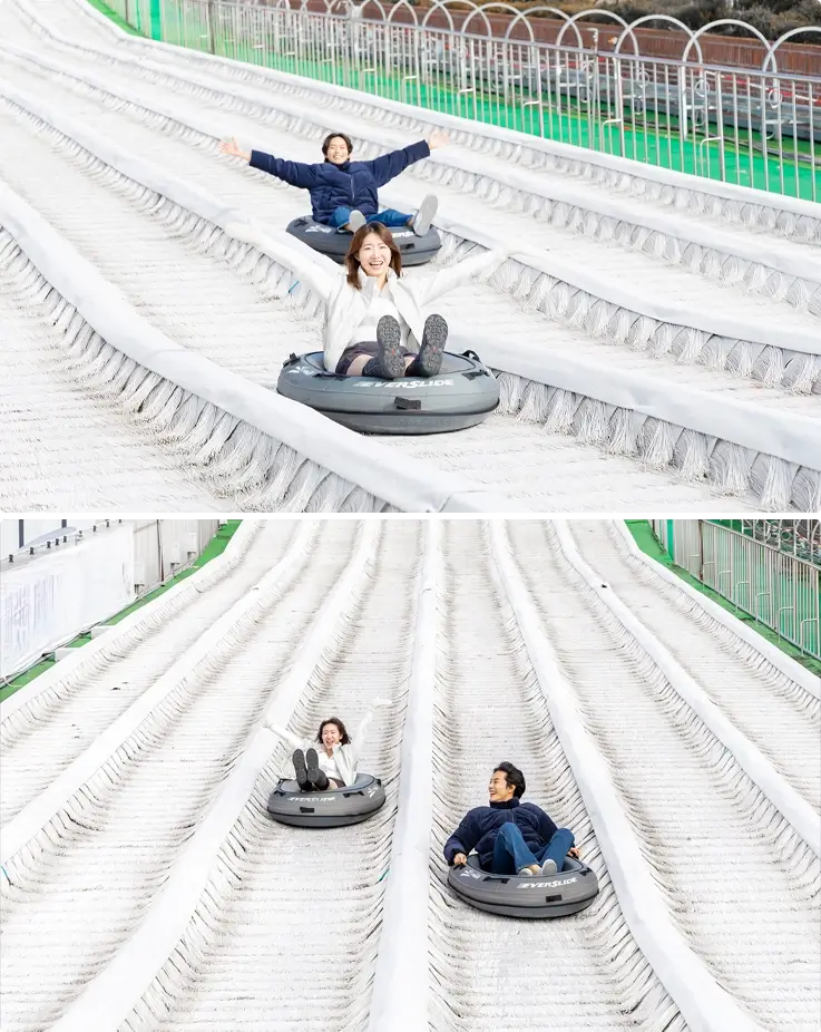 Visitors riding the Everslide at Onemount Snow Park in Goyang