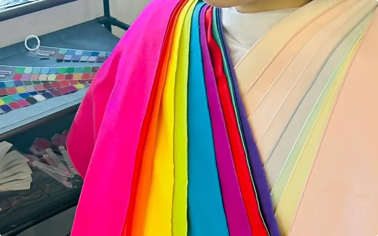 Visitor wearing color draping fabric during a personal color analysis in Busan
