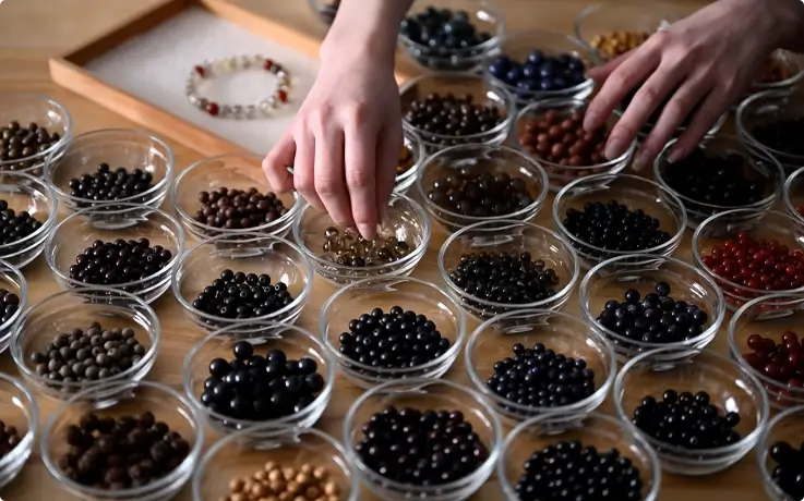 Beads for a prayer bead bracelet displayed at the workshop.