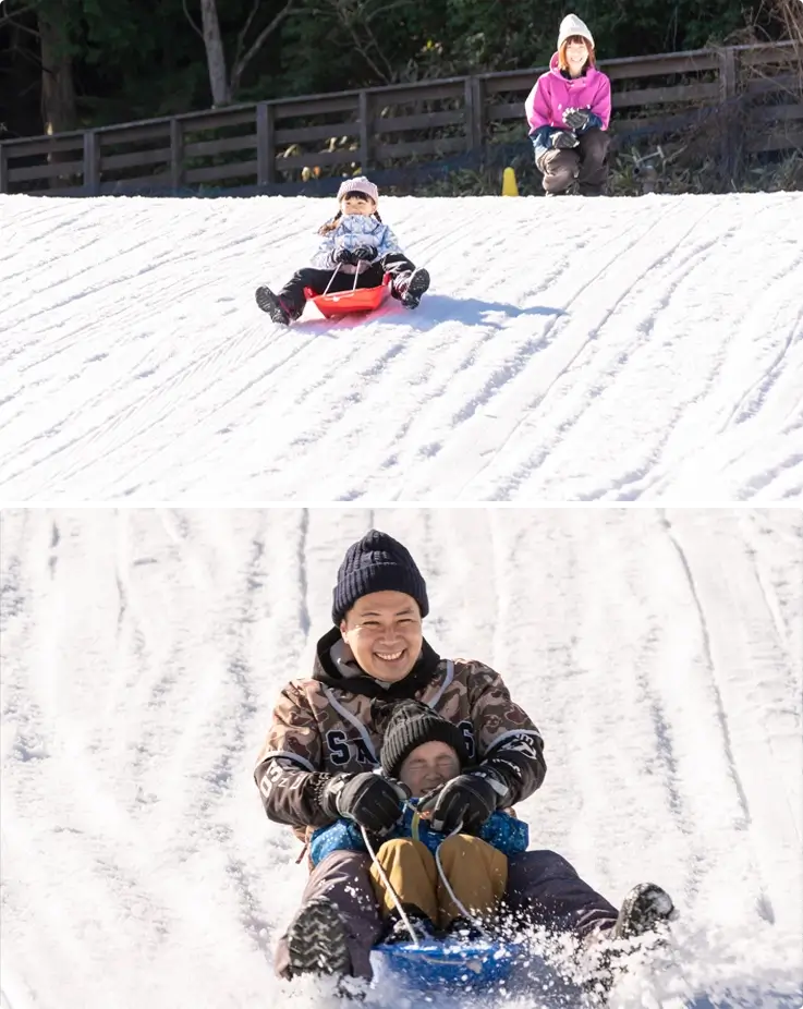 Family enjoying snow sled at Rokko Snow Park