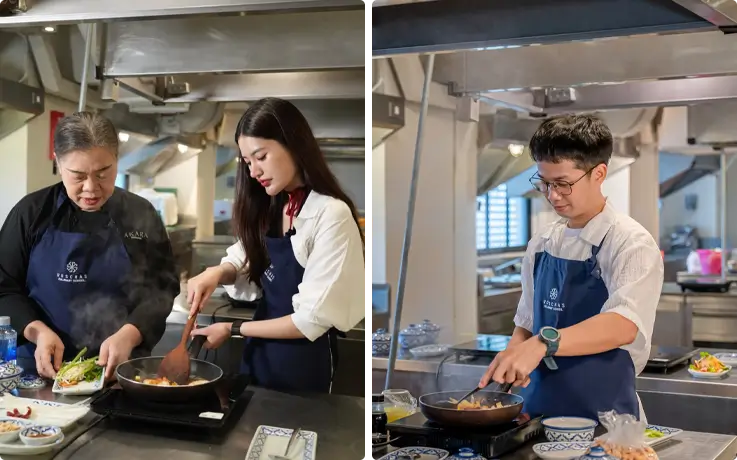 Visitors learning to cook Thai dishes at Roschas Culinary School in Bangkok