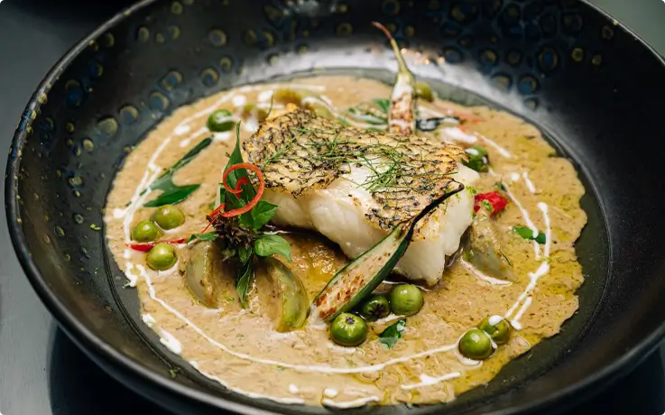 Grilled snow fish in green curry served at Saffron in Banyan Tree Bangkok