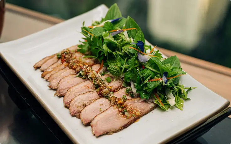Marinated grilled beef tenderloin salad with Thai herbs served at Saffron in Banyan Tree Bangkok